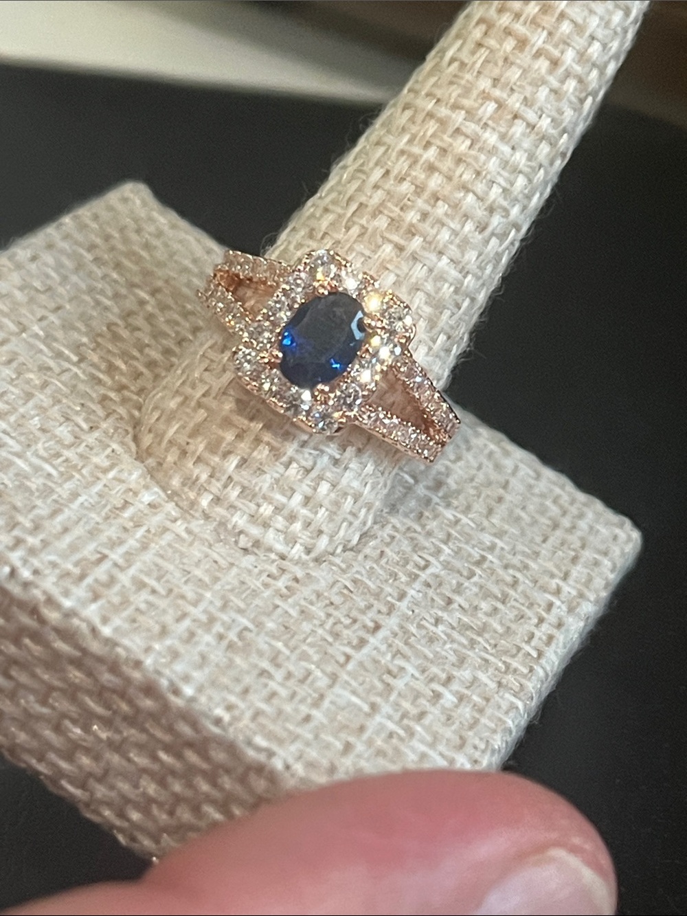 Rose Gold Ring with Deep Blue Oval Center and Halo
